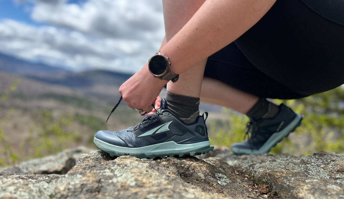 lacing up the Altra Lone Peak 8 hiking shoes