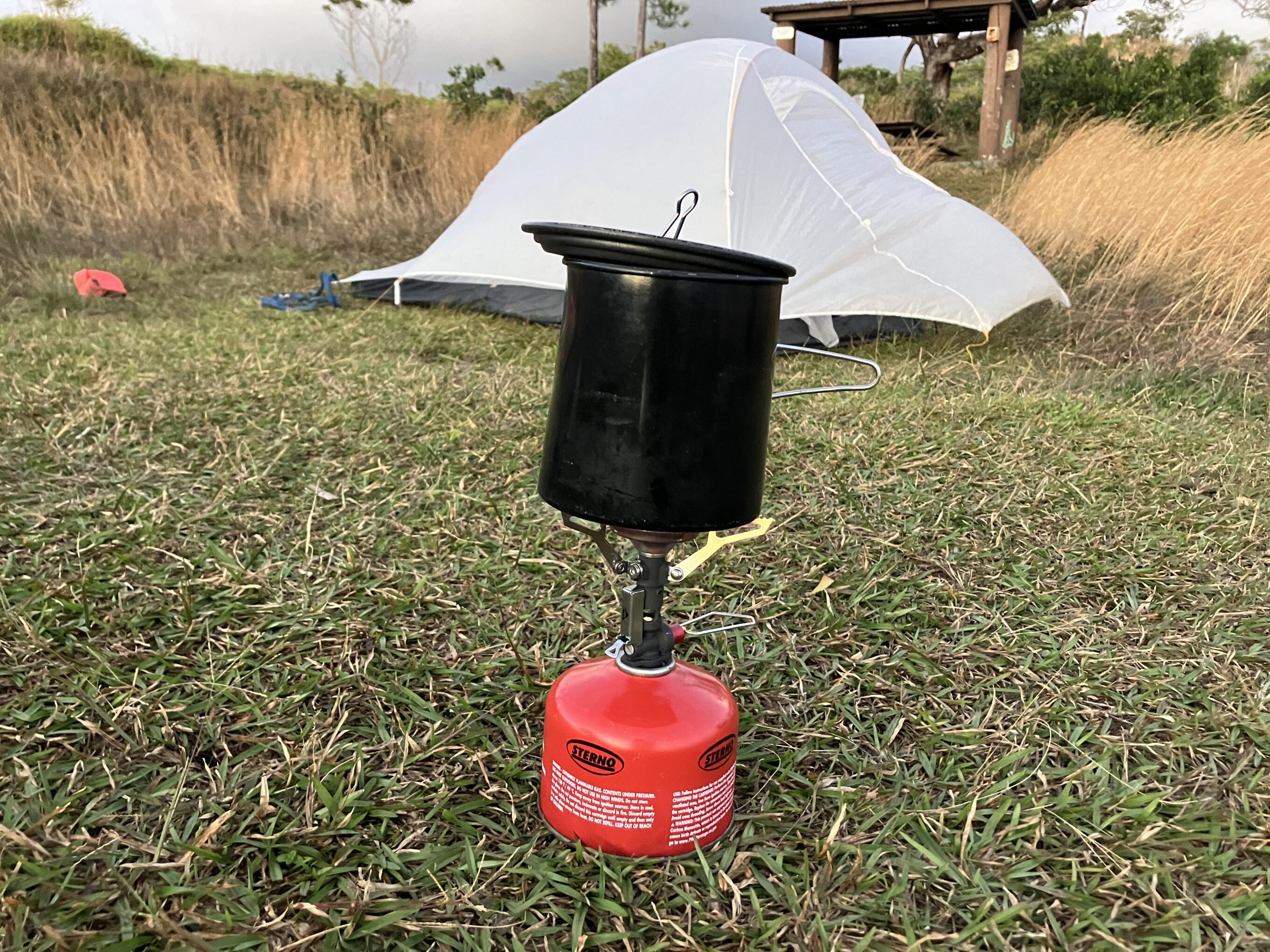 MSR PocketRocket backpacking stove in front of a tent