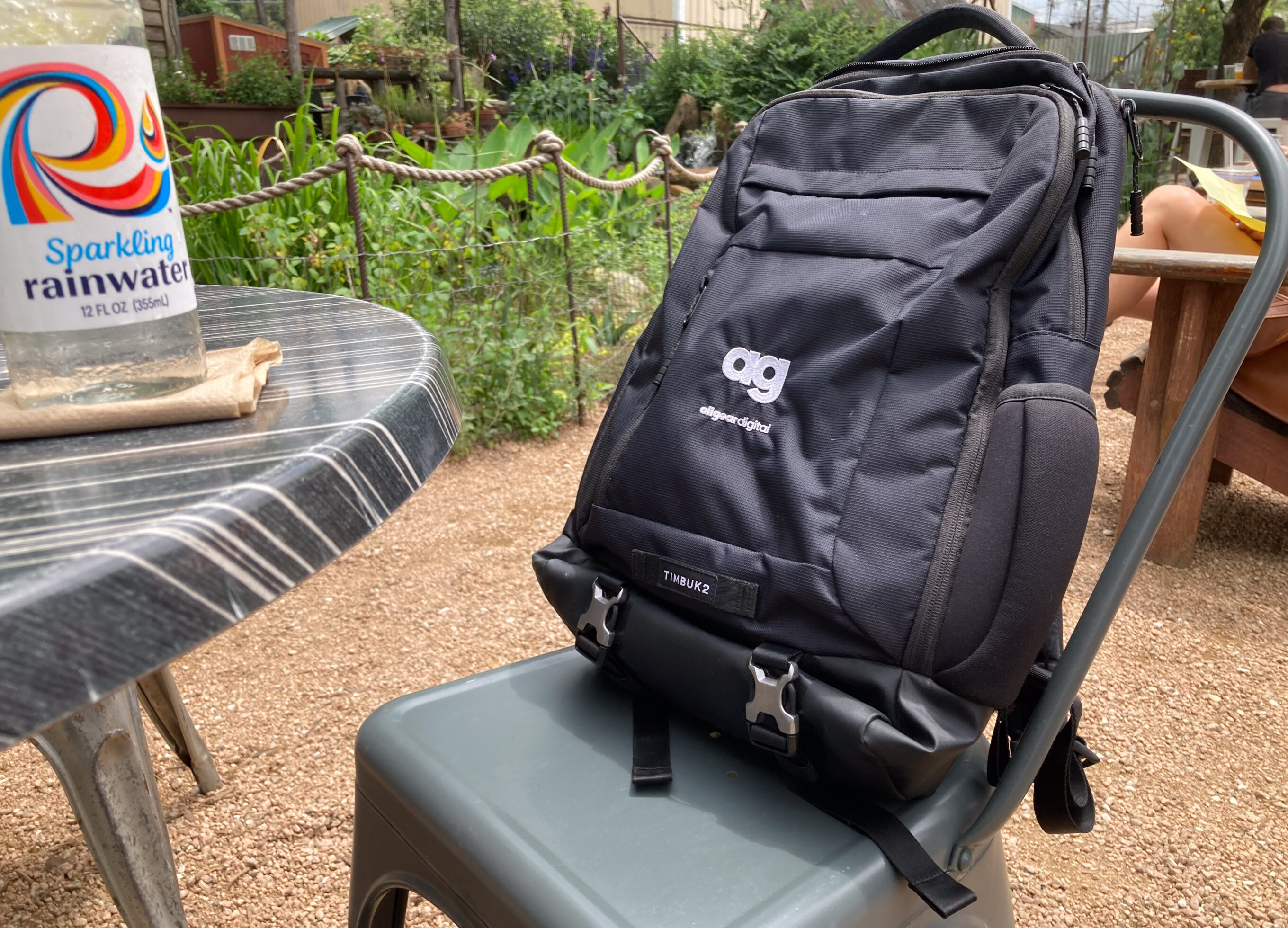 a travel backpack at an outdoor cafe