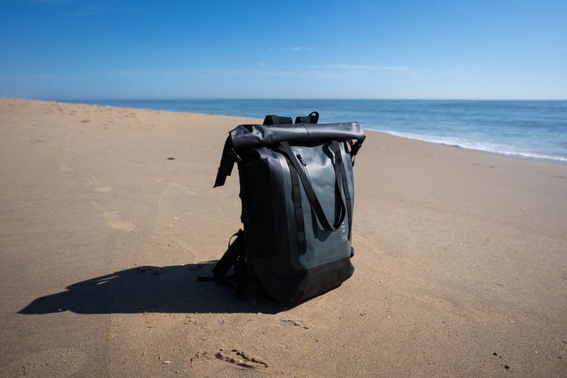 A calm surf with a surf backpack