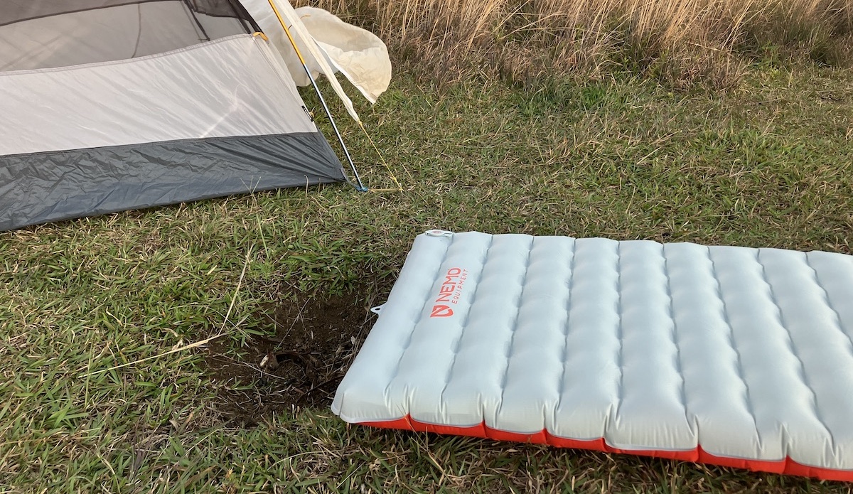 nemo tensor sleeping pad on the ground in front of a tent