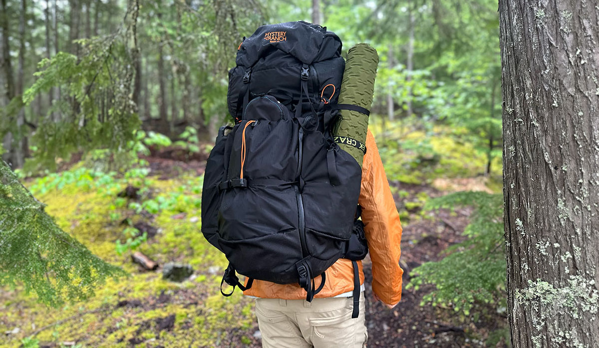 a hiker with the mystery ranch radix 57 backpack