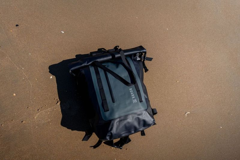 a surfbackpack on the beach