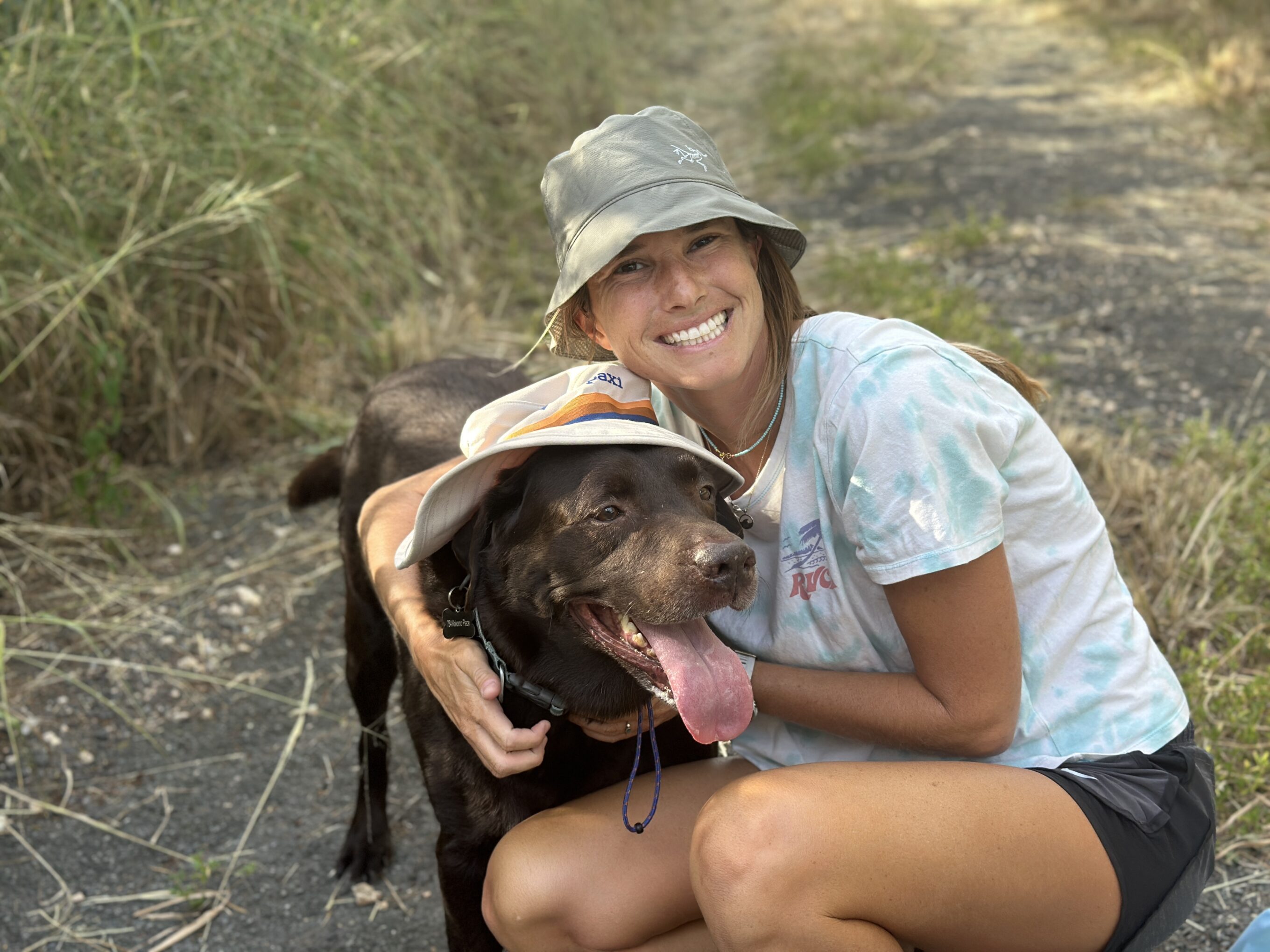 a woman and a dog wearing hats