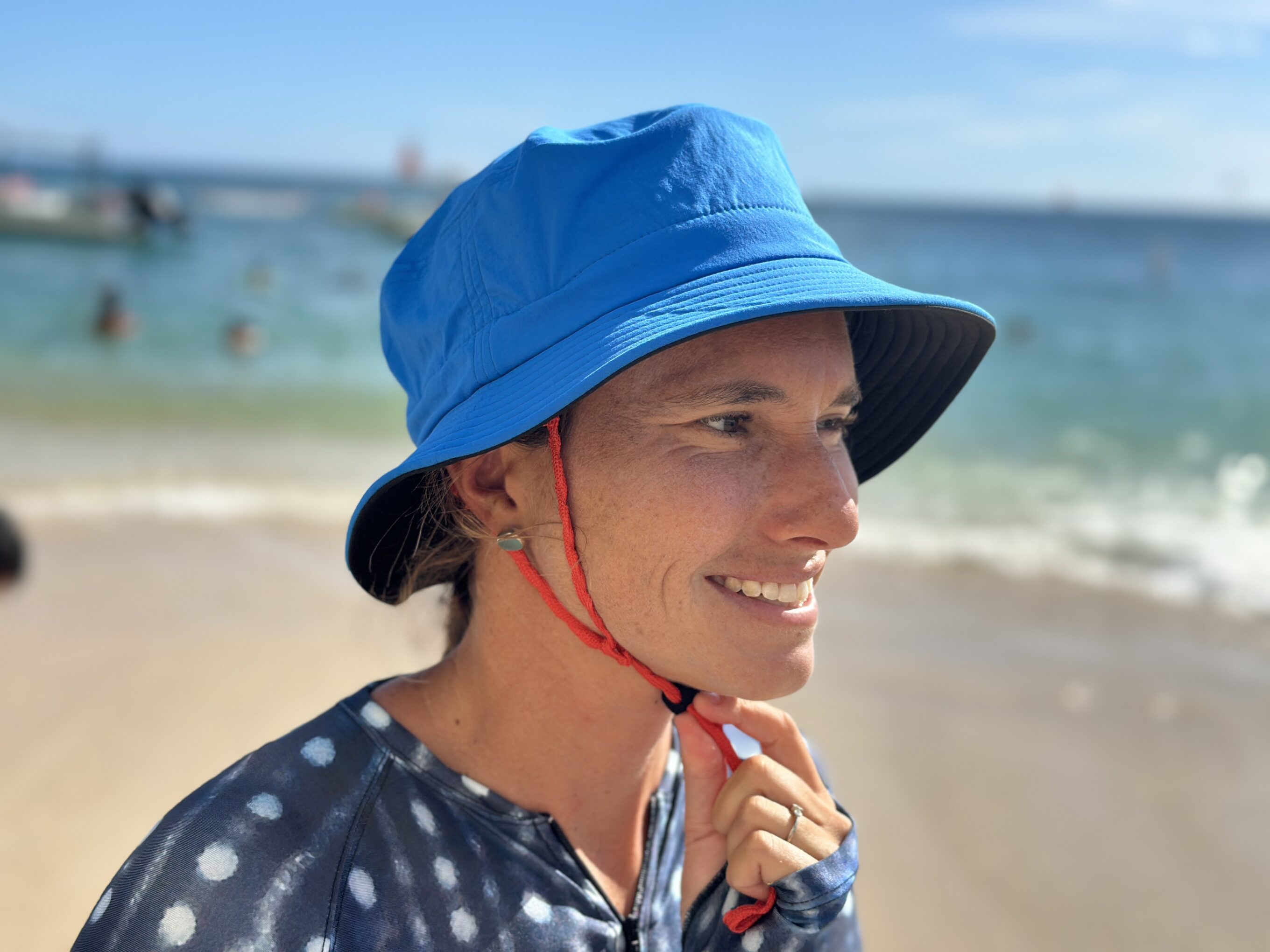 a woman wearing a patagonia surf hat