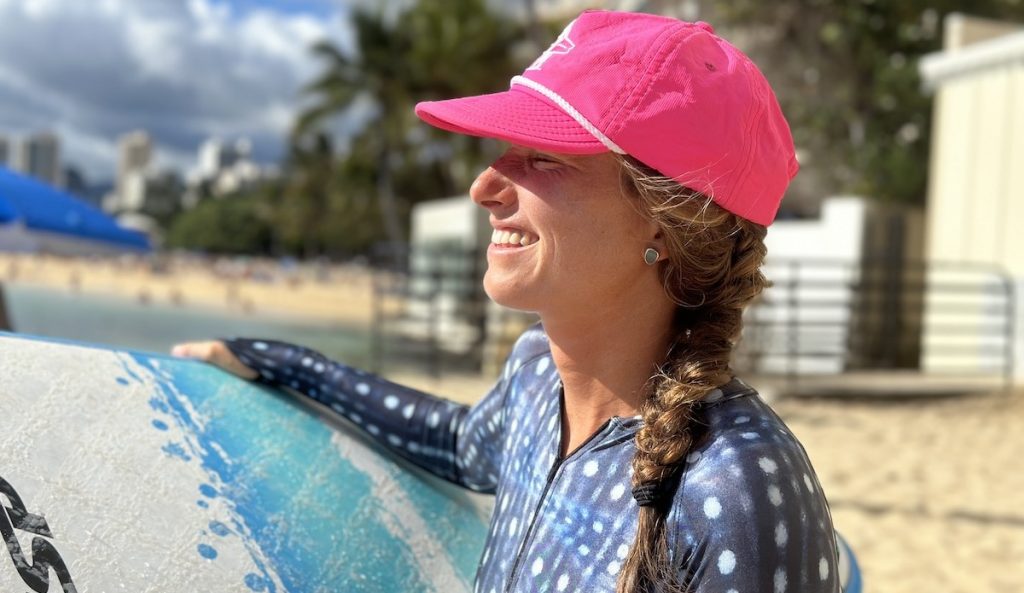 a woman wearing a surf hat