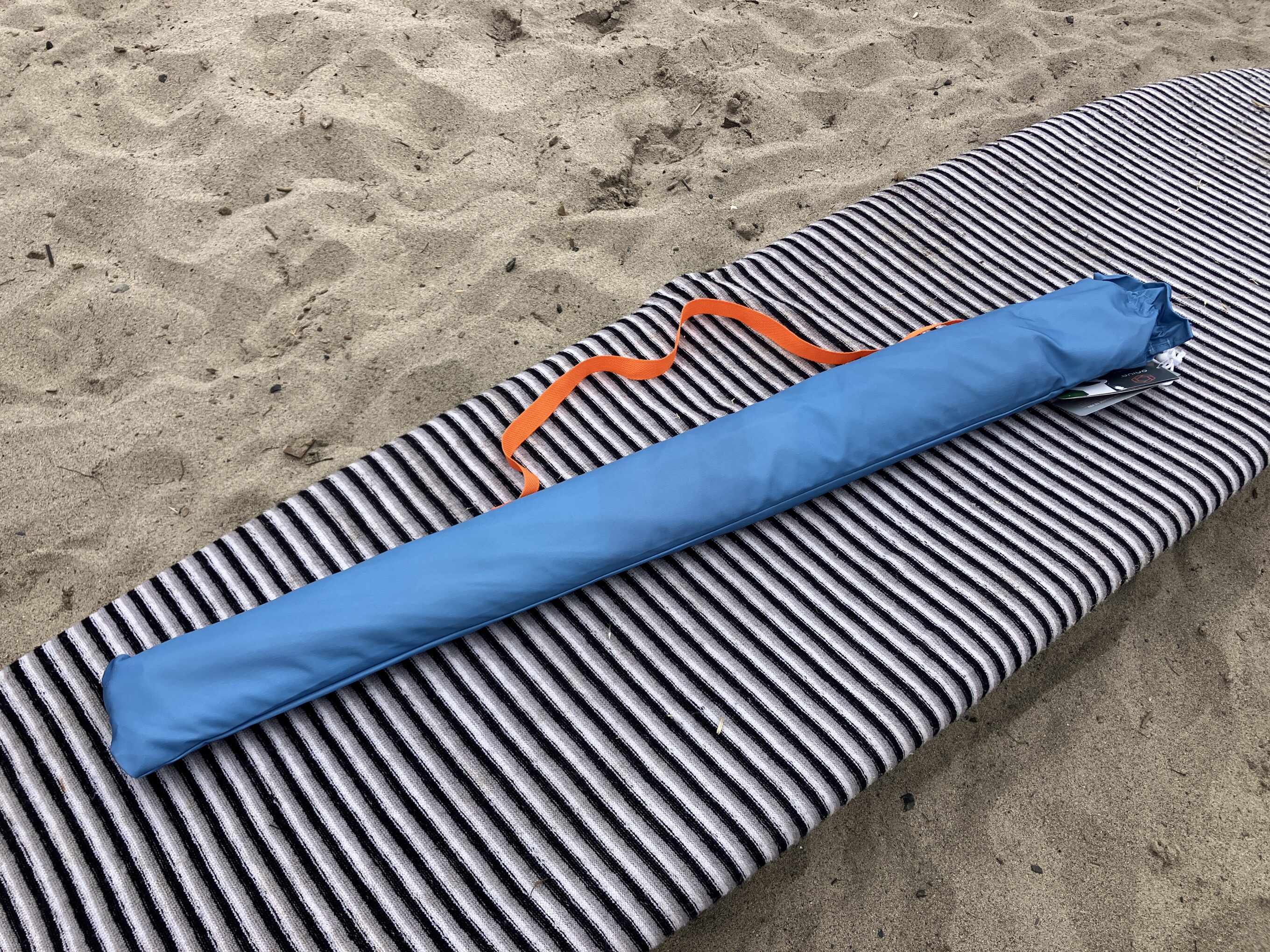 a beach umbrella packed down