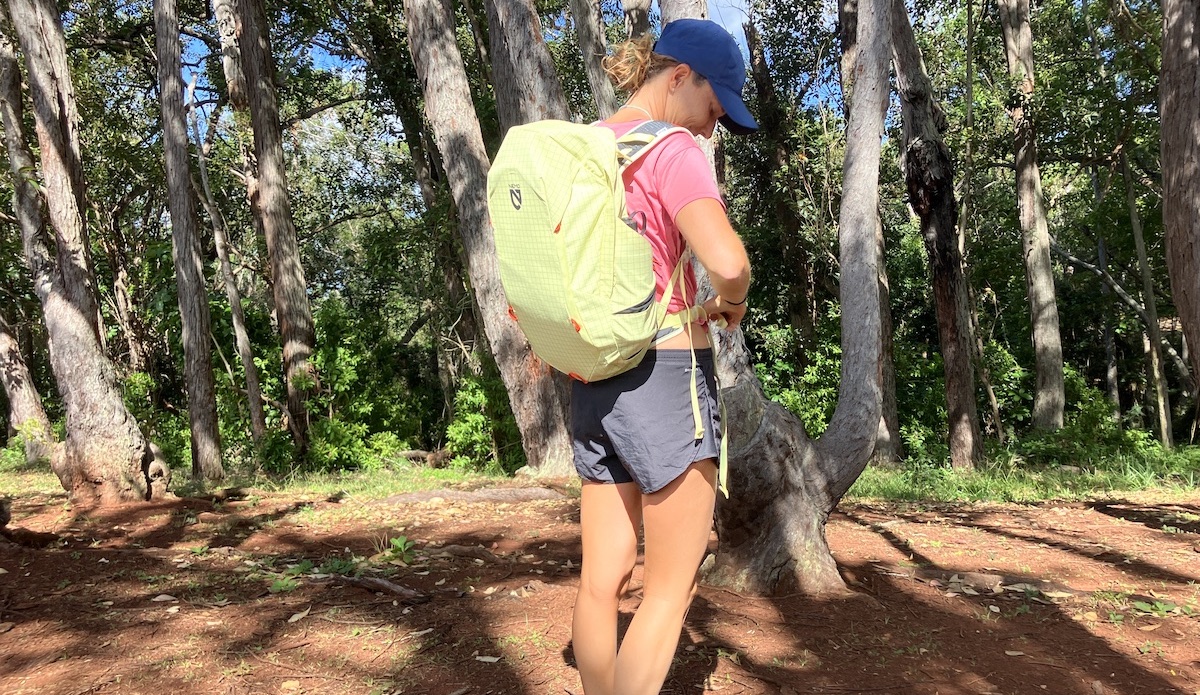 a woman wearing a hiking backpack