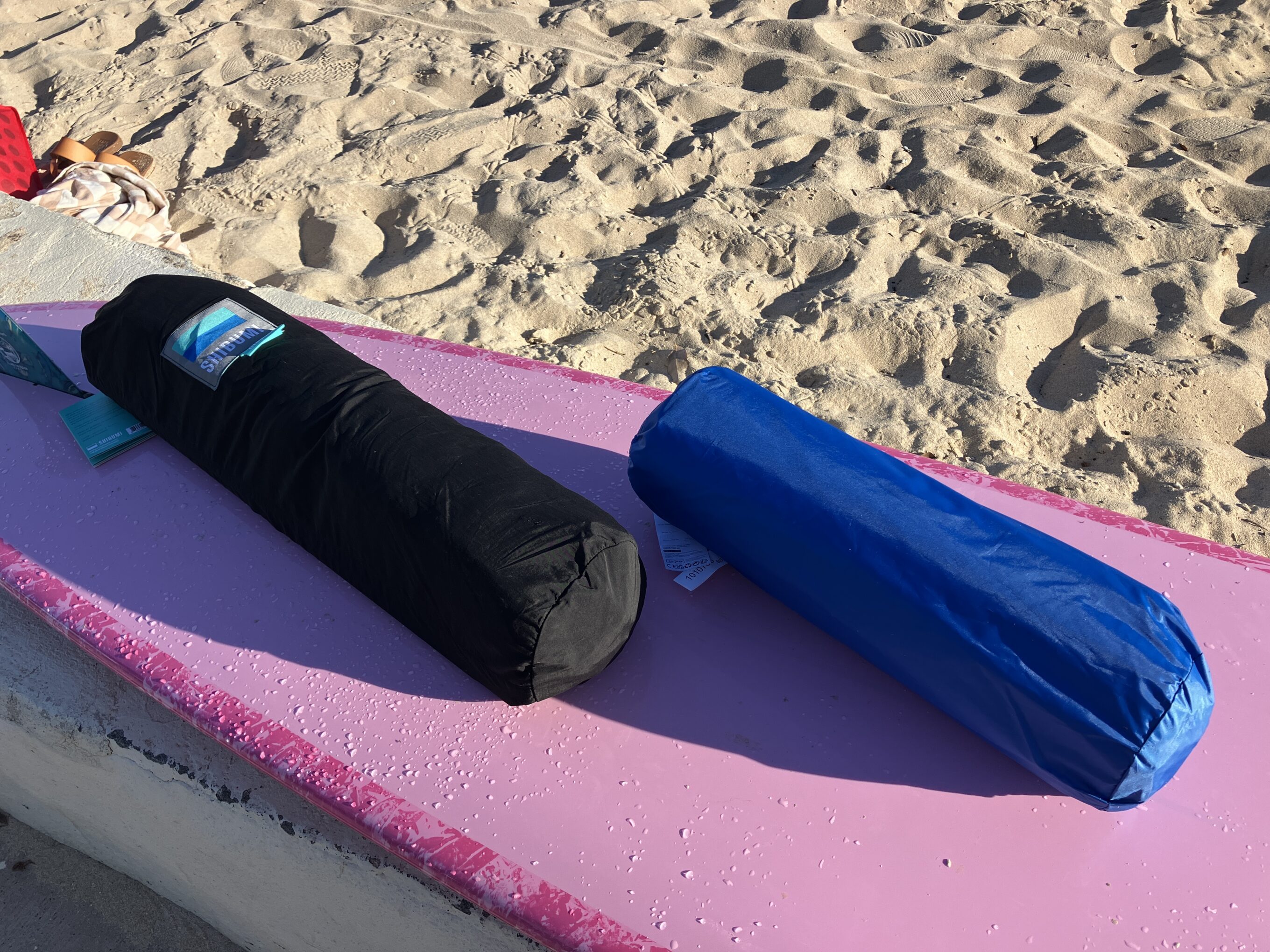 two beach canopies packed up