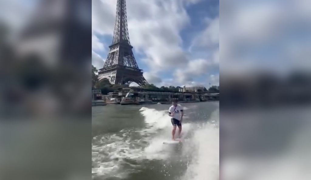 Kauli Vaast braves the famously polluted waters of the Seine to celebrate winning Olympic gold. Photo: Surfing France // Instagram