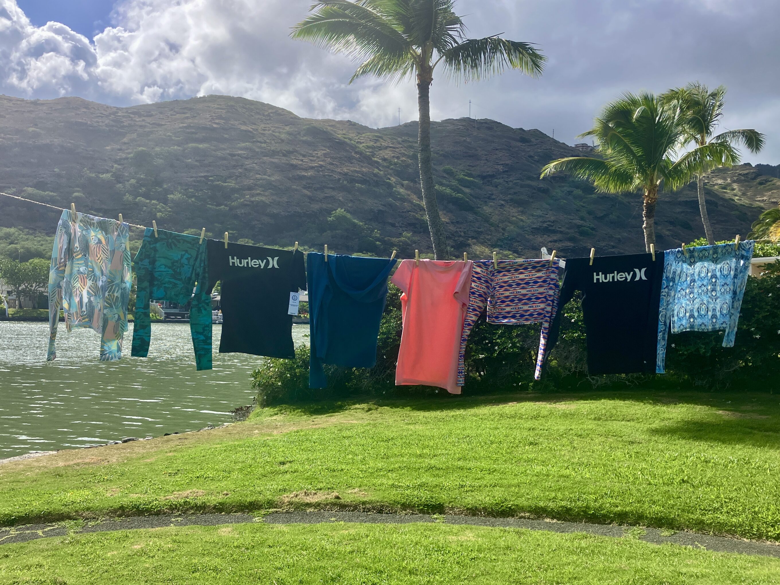 women's rash guards handing on a clothesline