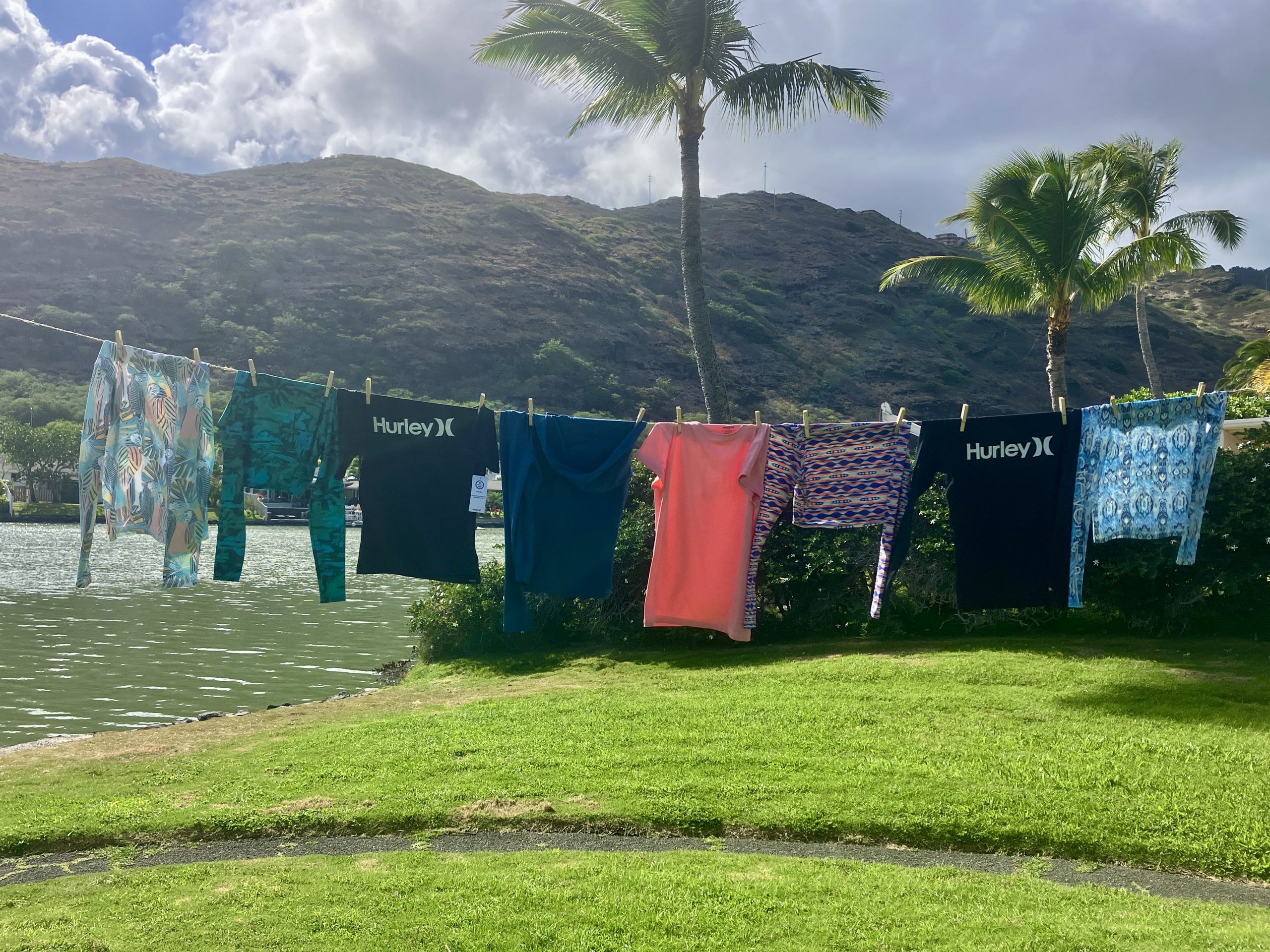 women's rash guards handing on a clothesline