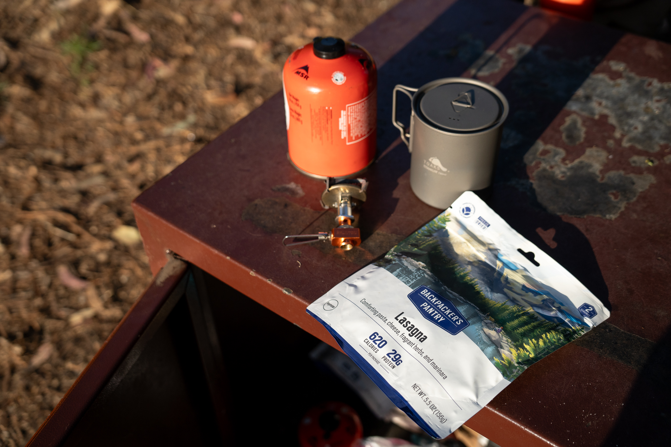 backpacking meal with stove and gas