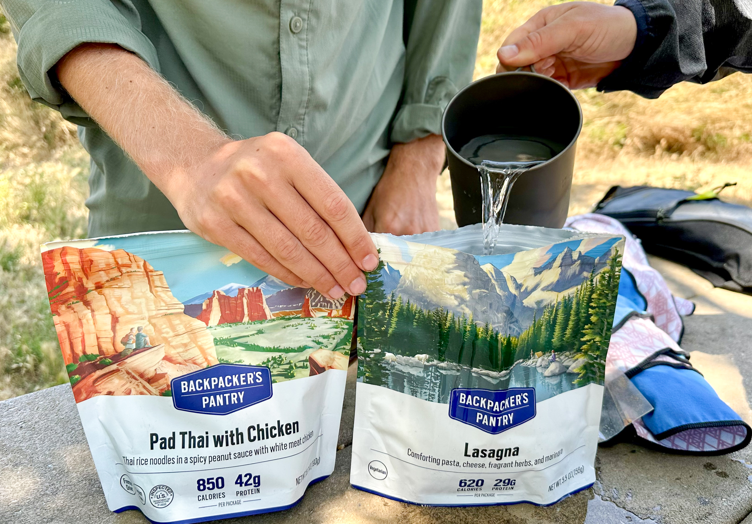 pouring water into a backpacking meal