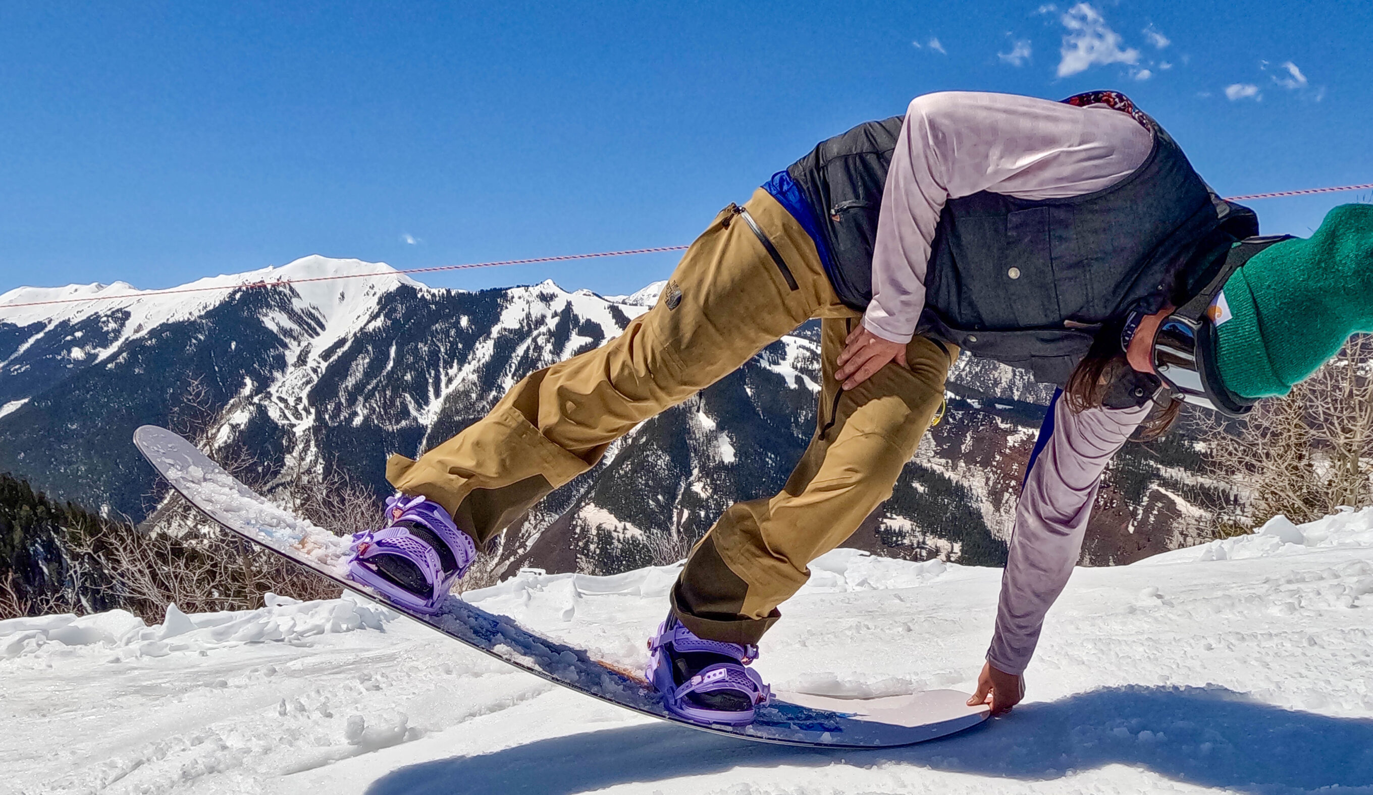 testing the flex on a women's snowboard