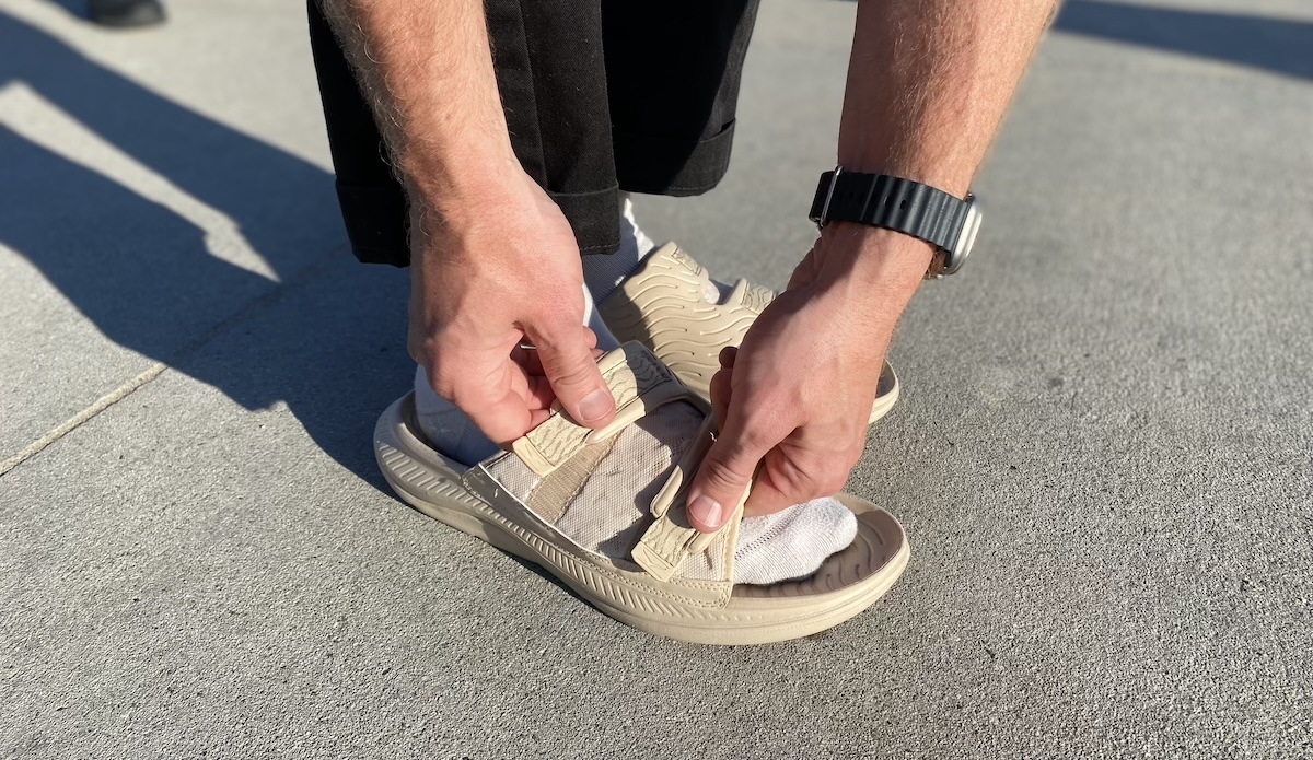 Doing the velcro straps on the Hoka Recovery Slides