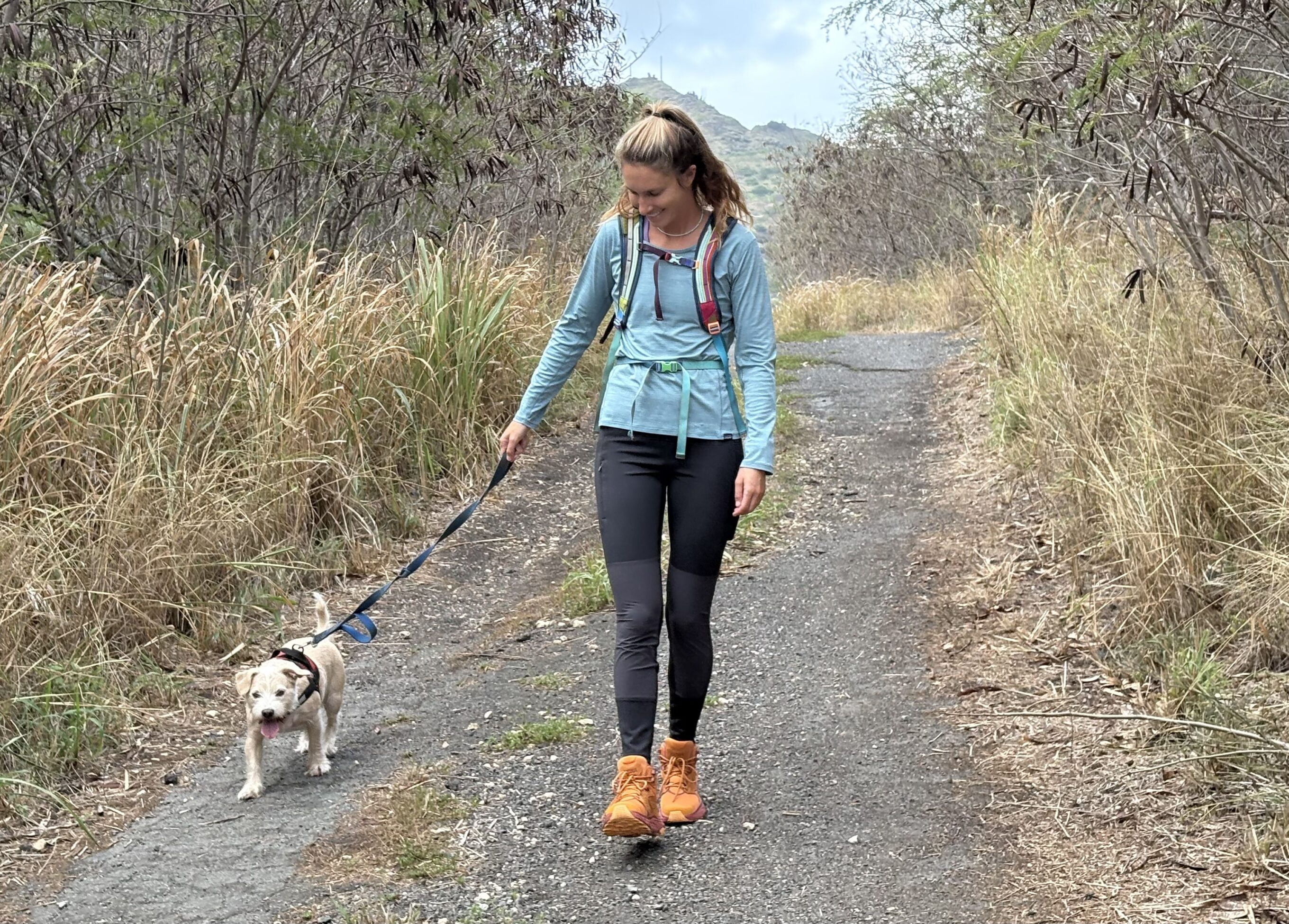 a woman walking her dog