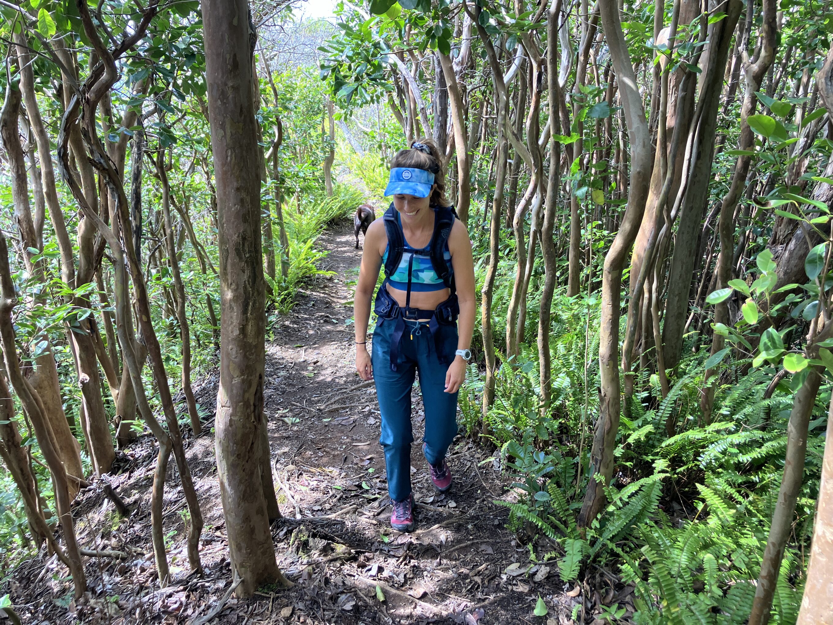 a woman hiking in the forest