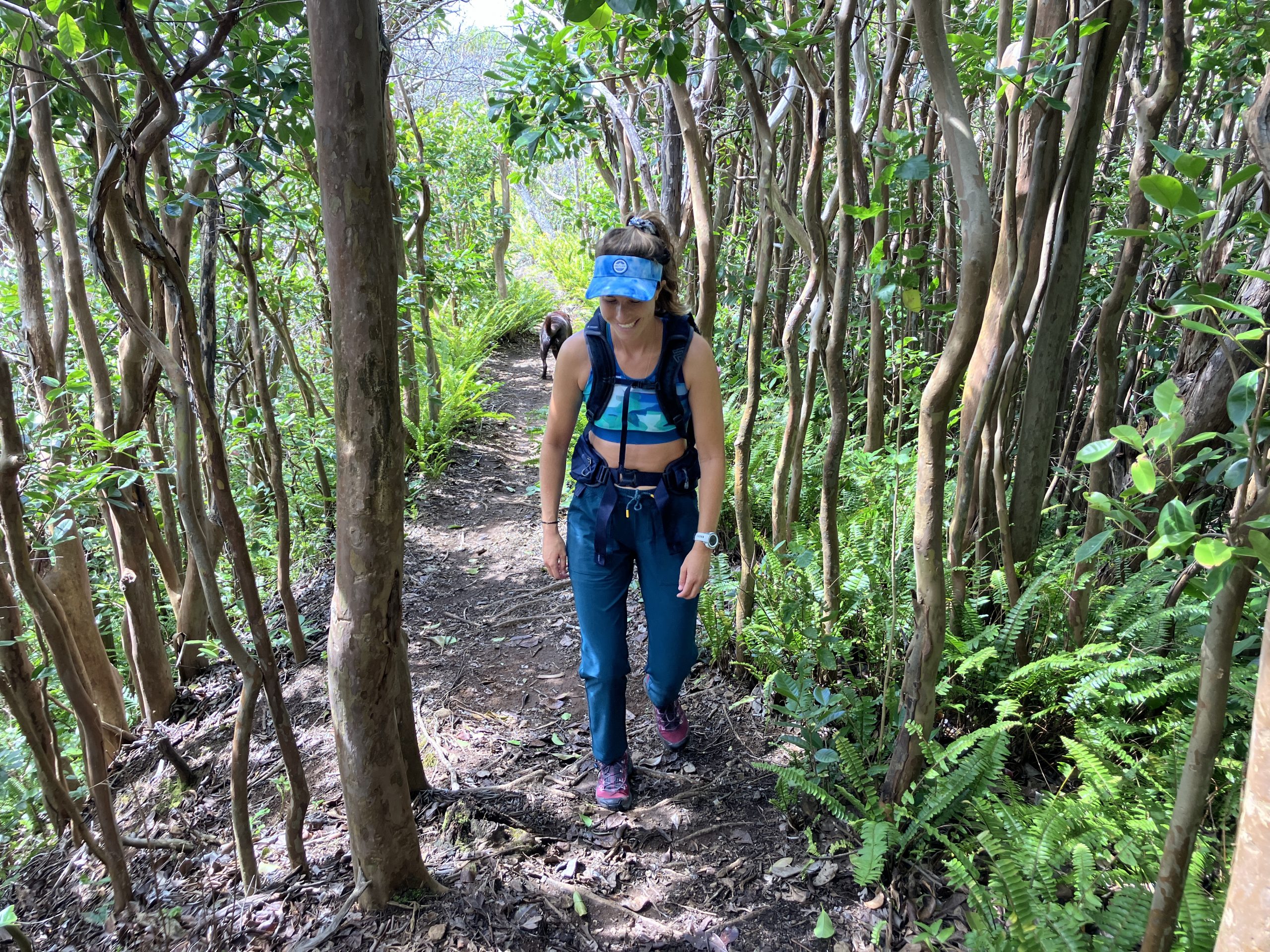 a woman hiking in the forest