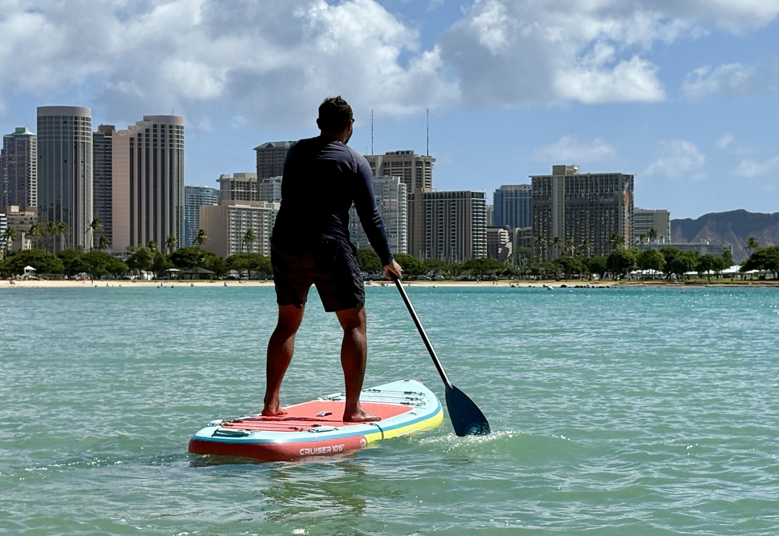 a man paddle boarding