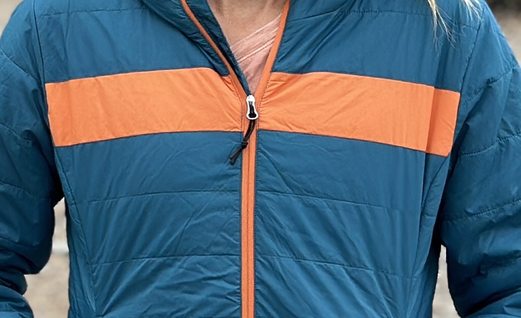 close up of a zipper on a puffer jaket