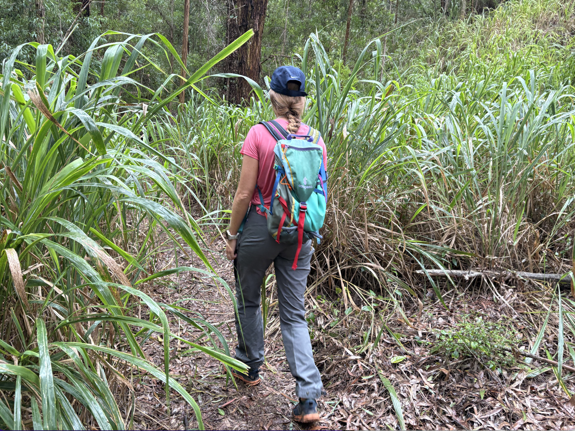 a woman walking in the woods 