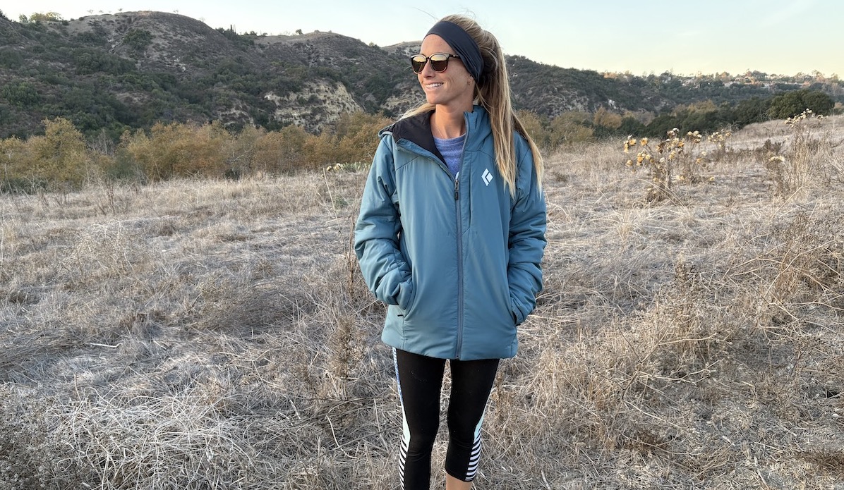 a woman in a first light black diamond puffer