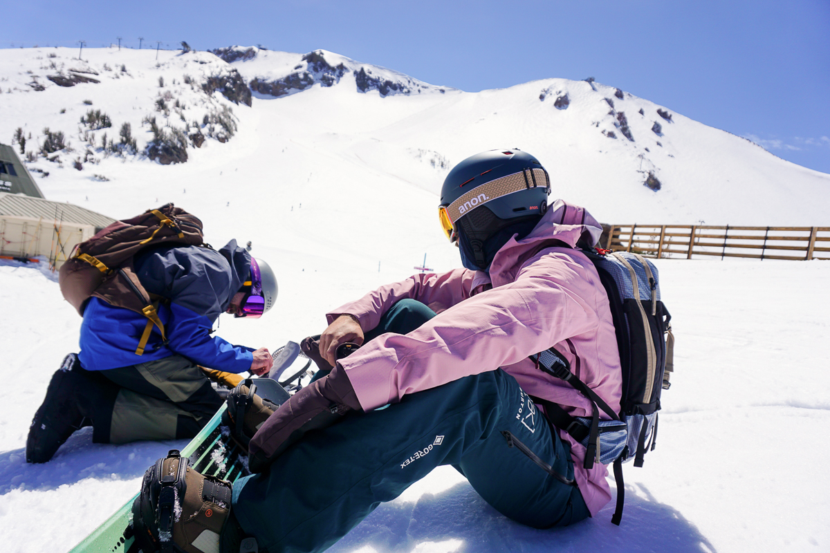 snowboarders preparing for a run