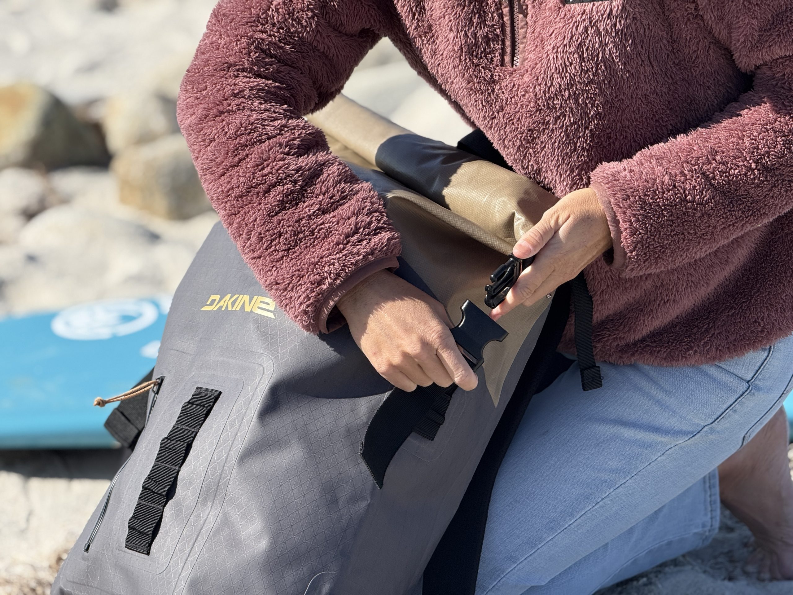 a buckle on a surf backpack