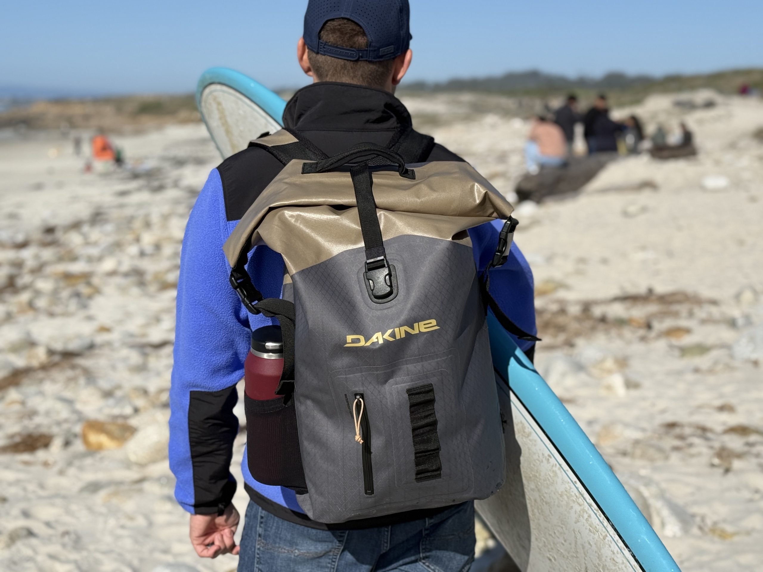 a man wearing a Cyclone surf backpack