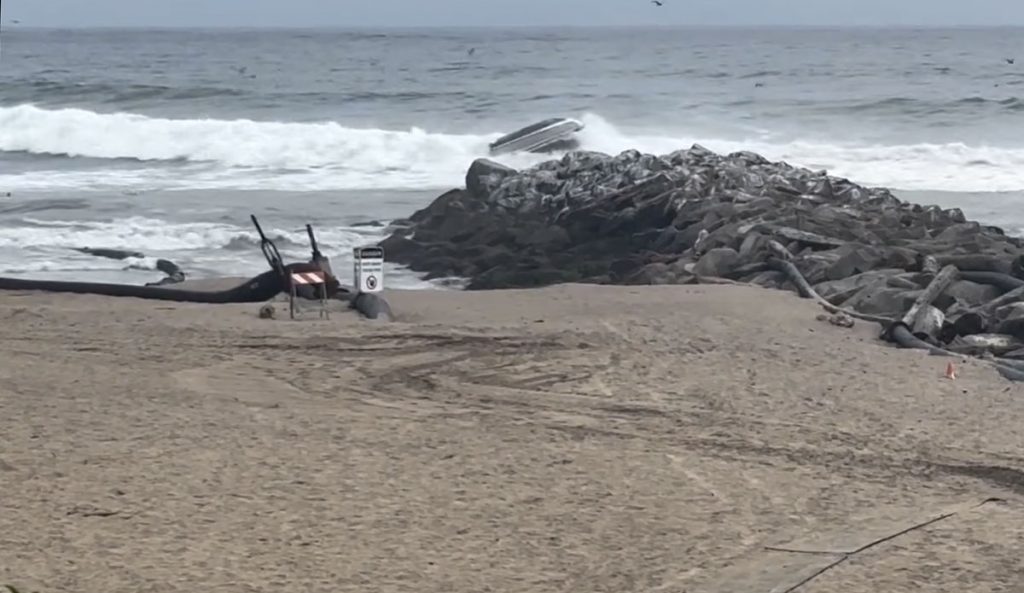 Boat flips at Santa Cruz Harbor