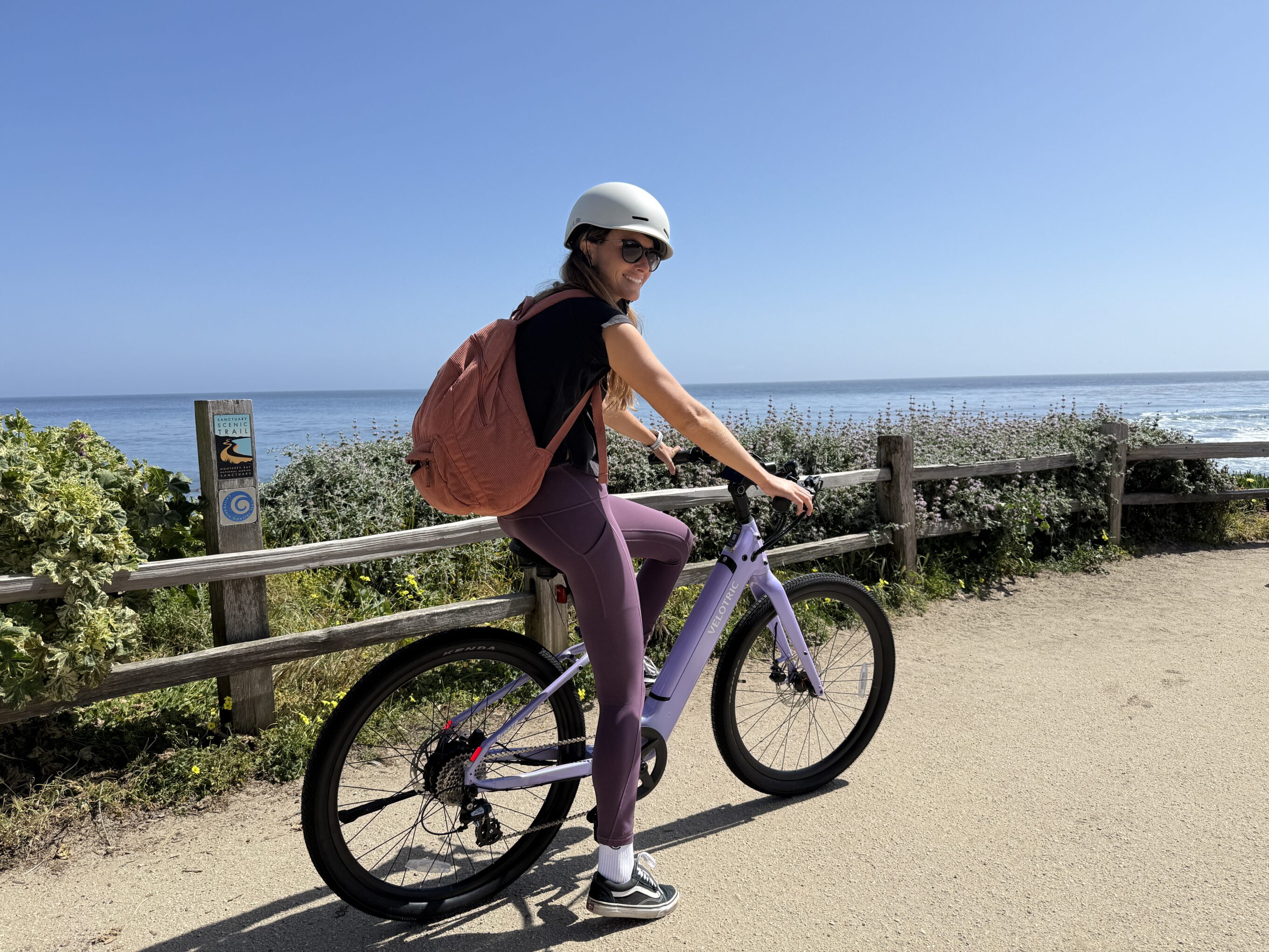 a woman riding an electric bike