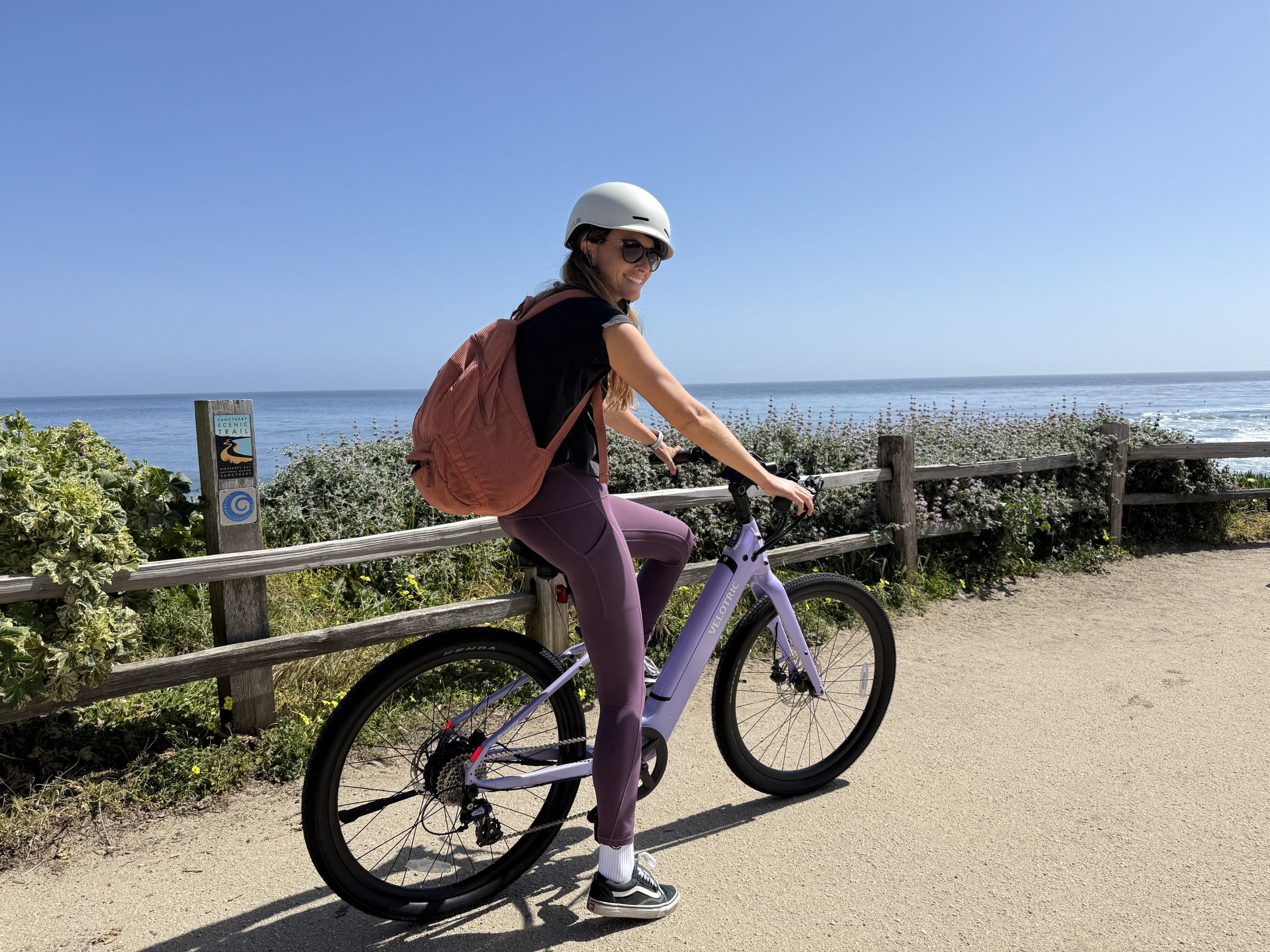 a woman riding an electric bike