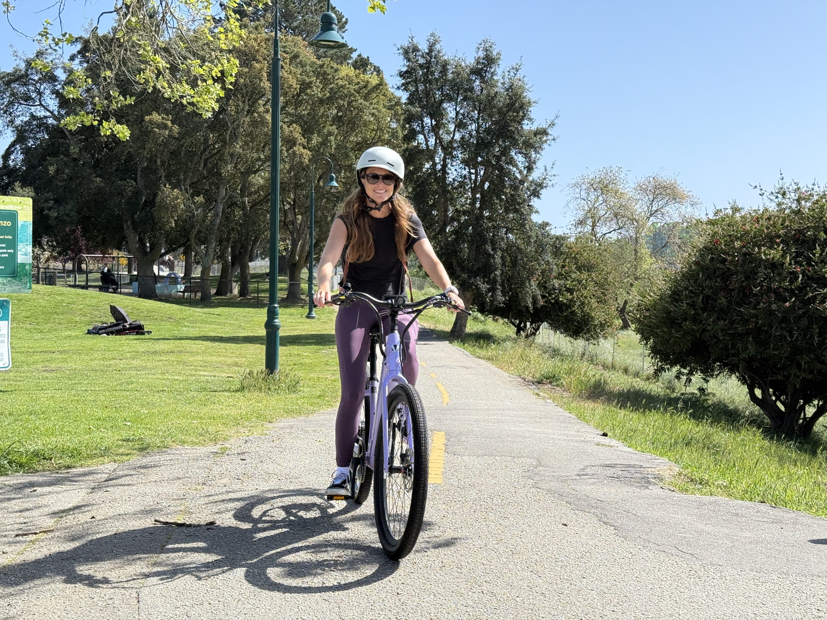 a woman riding an e bike