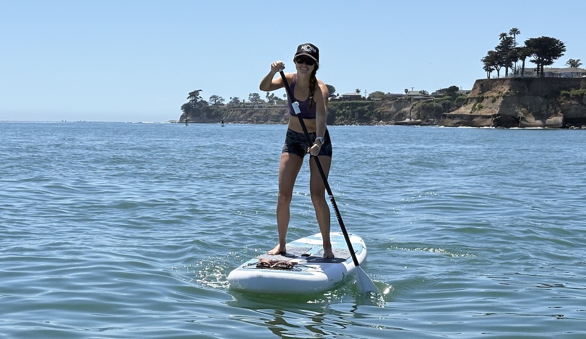 a woman stand up paddling on a Chasm-Lite
