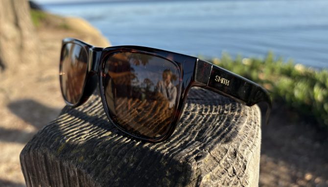 Smith Lowdown sunglasses on a fencepost by the water
