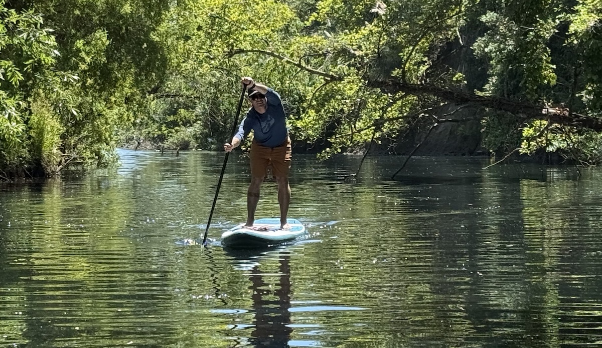 a man paddling on a river