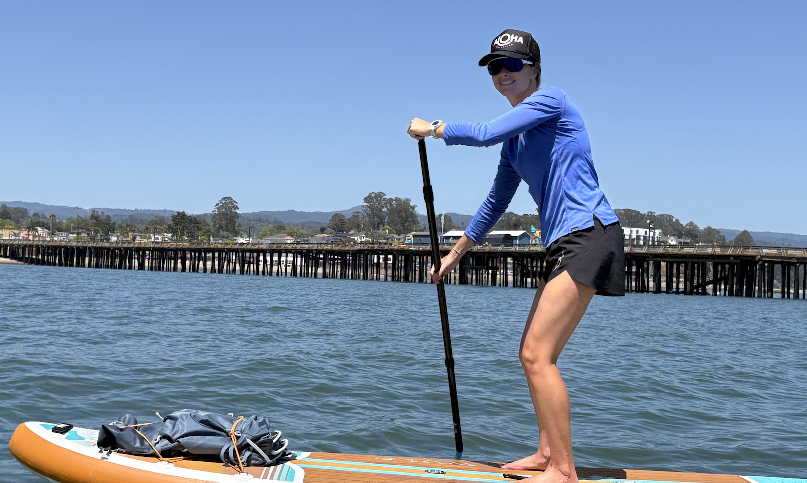 wearing the Roka San Remo Air sunglasses while paddle boarding