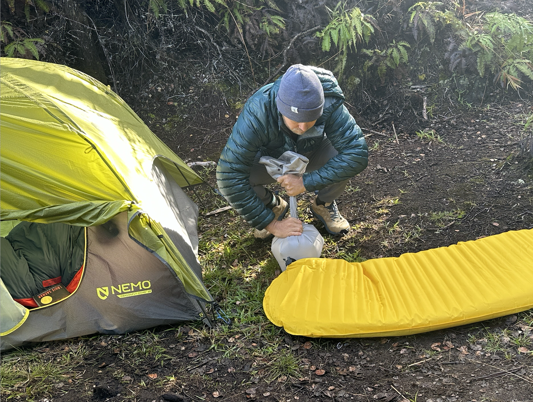 a man next to a tent