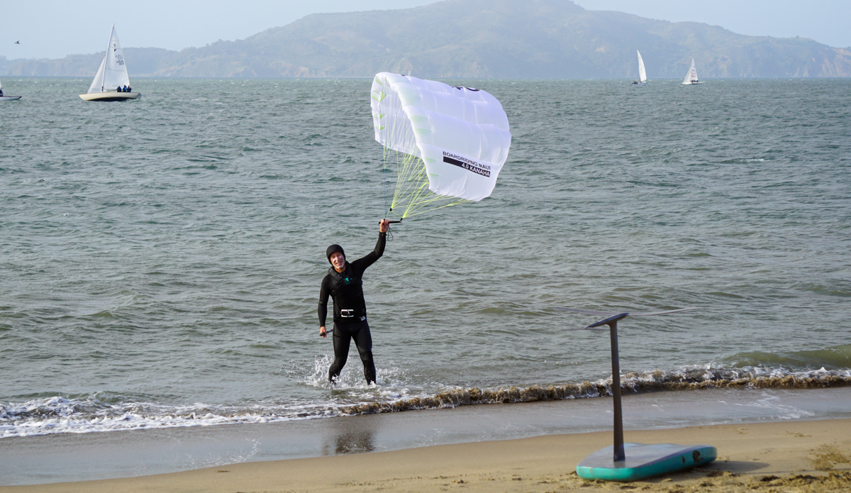 bowen coming out of the water with parawing in hand