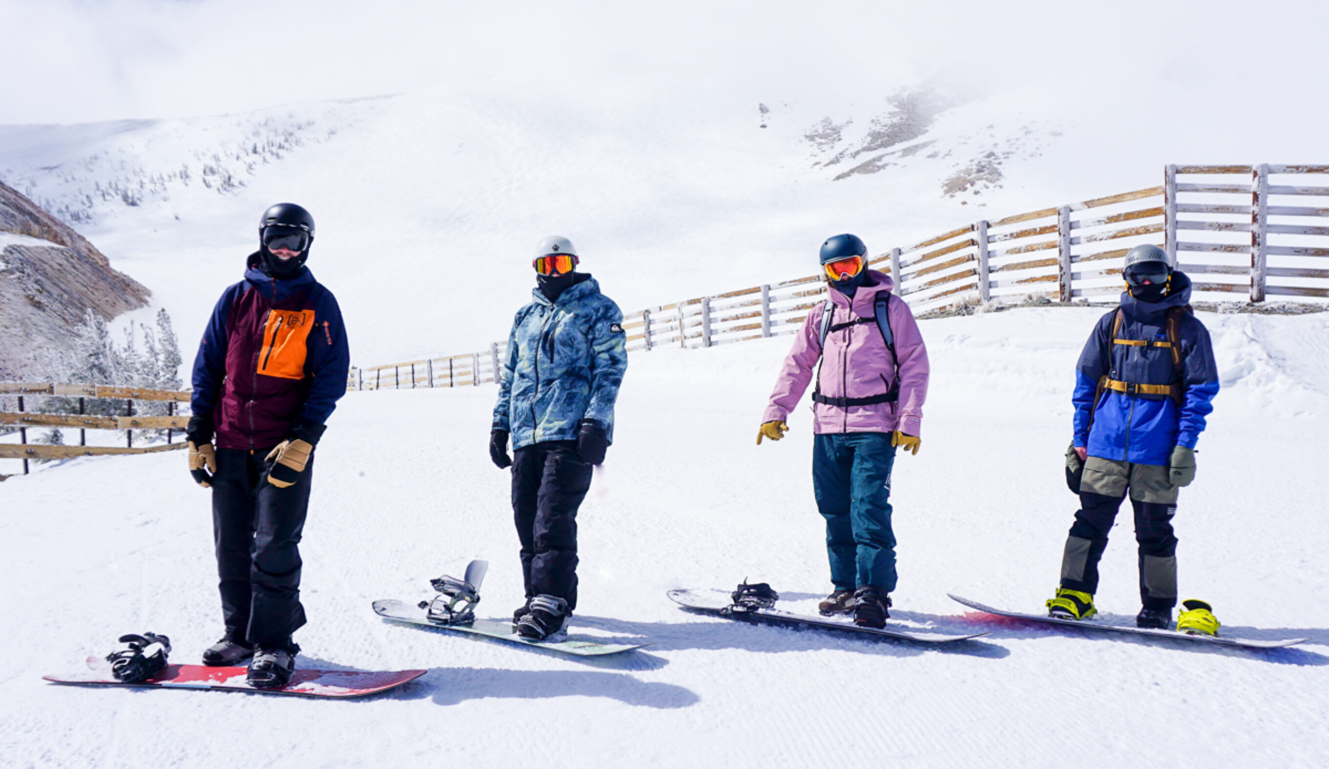 four snowboarders