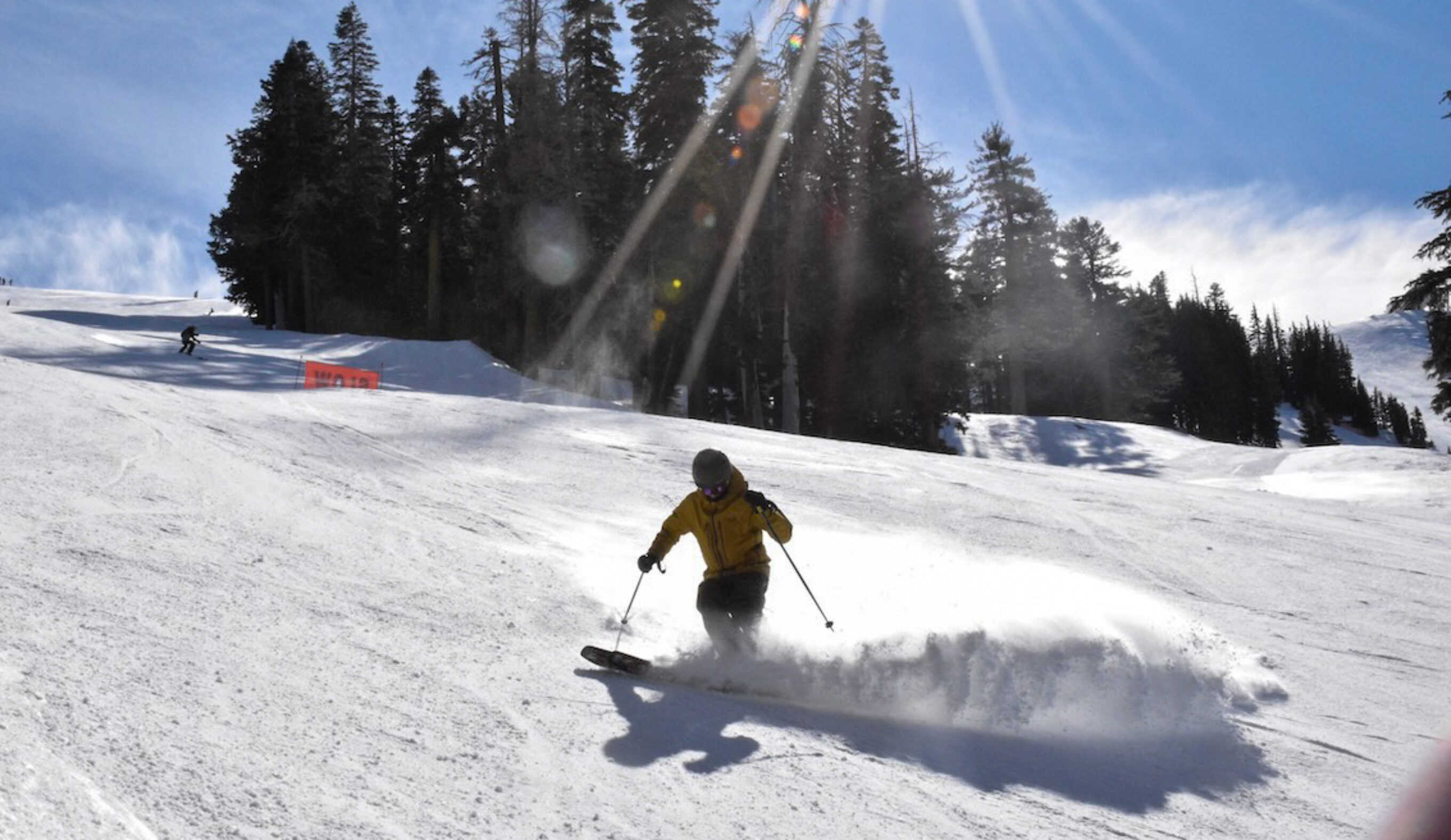 Skiing in the Mountain Hardwear High Exposure Bibs