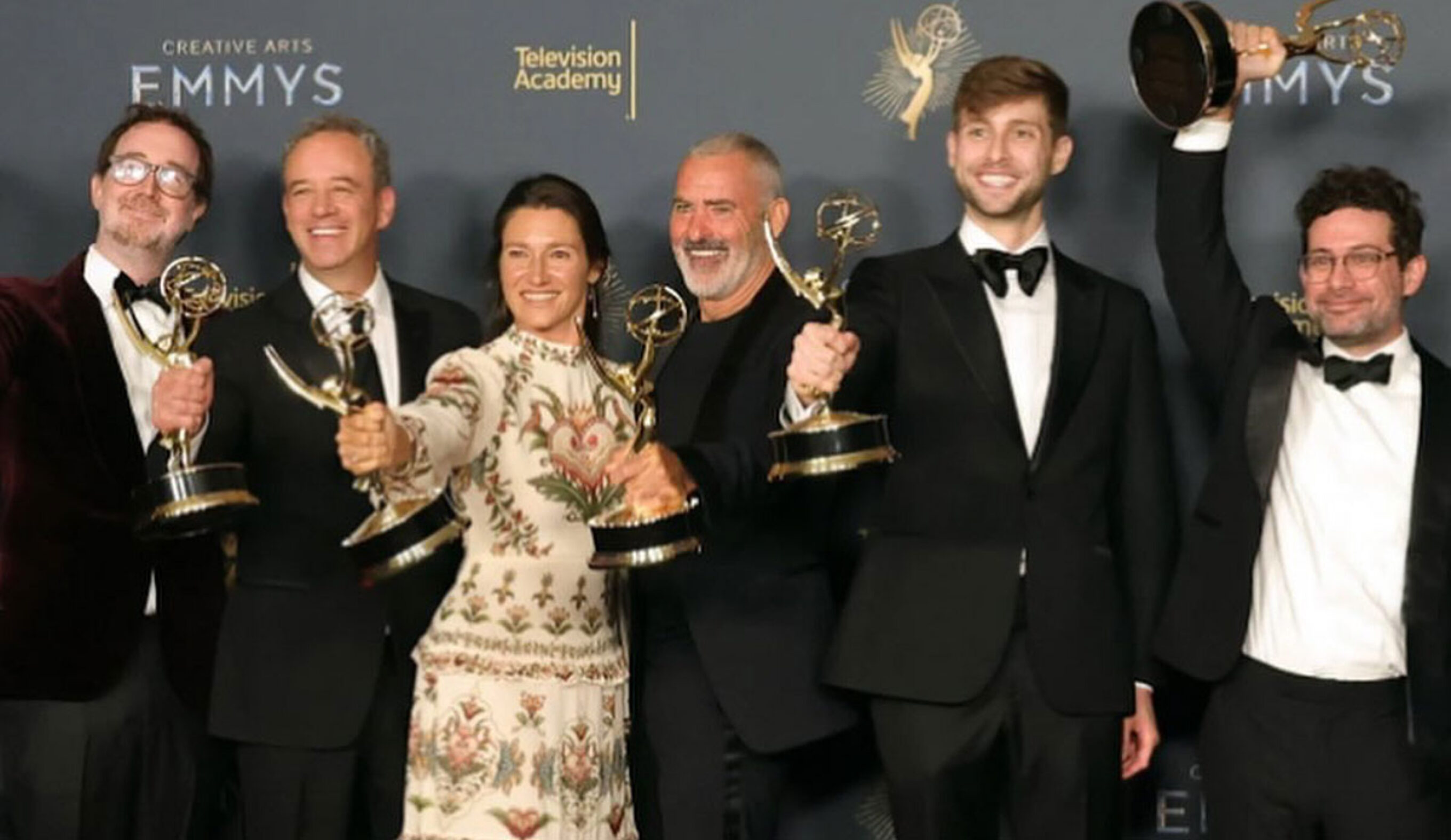 100 Foot Wave cast with Emmy Awards on stage at 2025 Emmys
