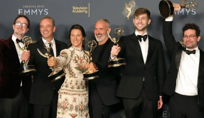 100 Foot Wave cast with Emmy Awards on stage at 2025 Emmys