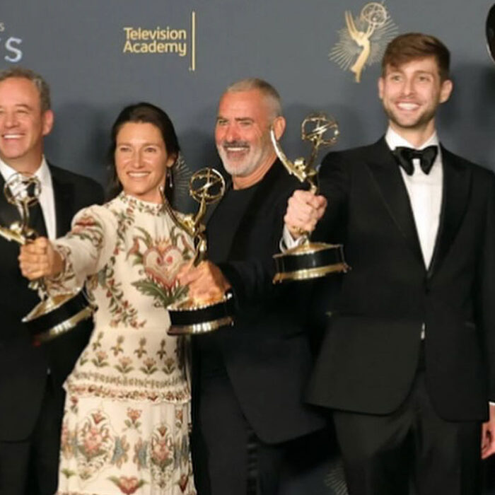 100 Foot Wave cast with Emmy Awards on stage at 2025 Emmys