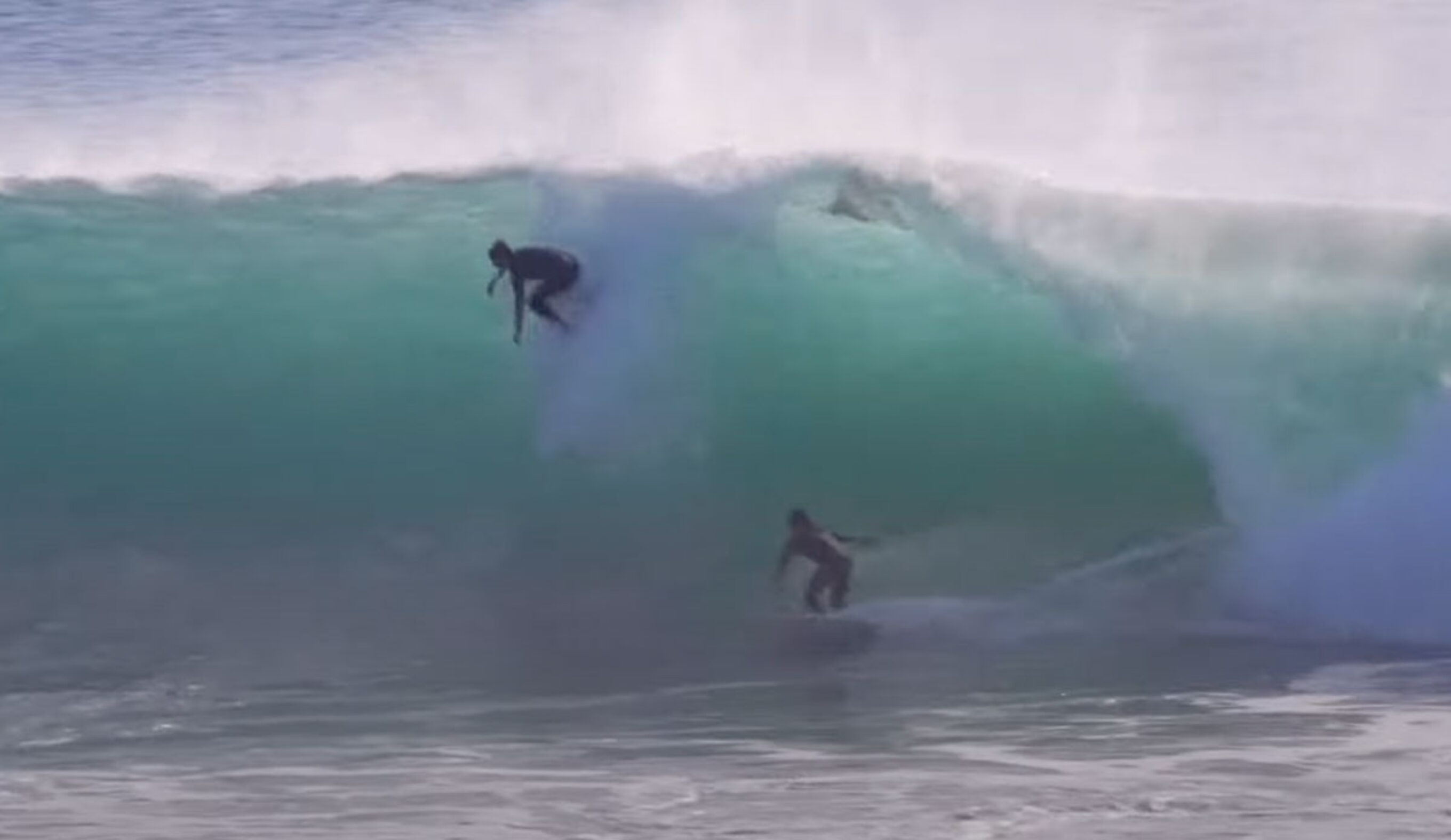 Kirra Point surfers on the same wave