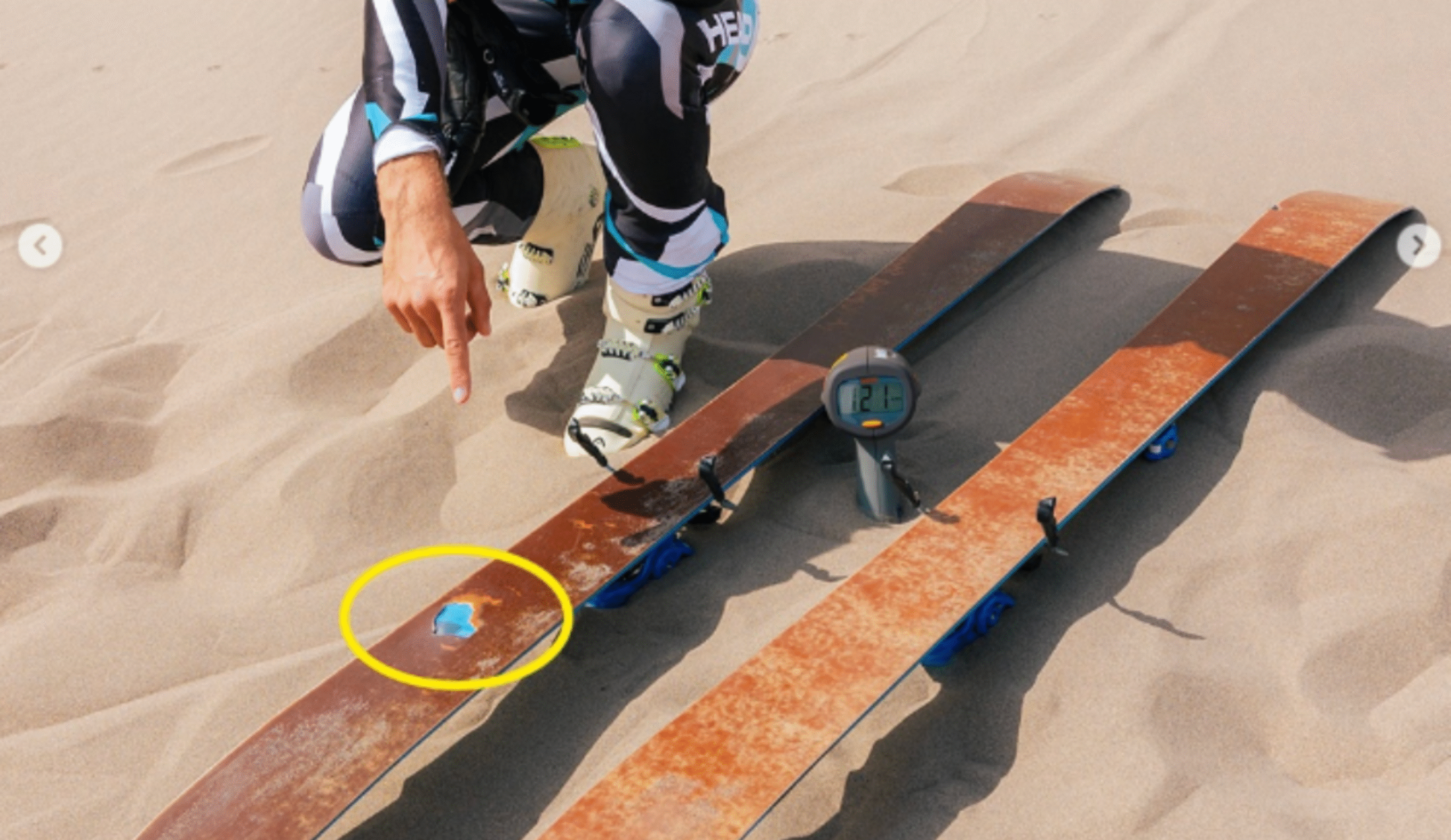 French skier inspecting his skis after breaking the world record