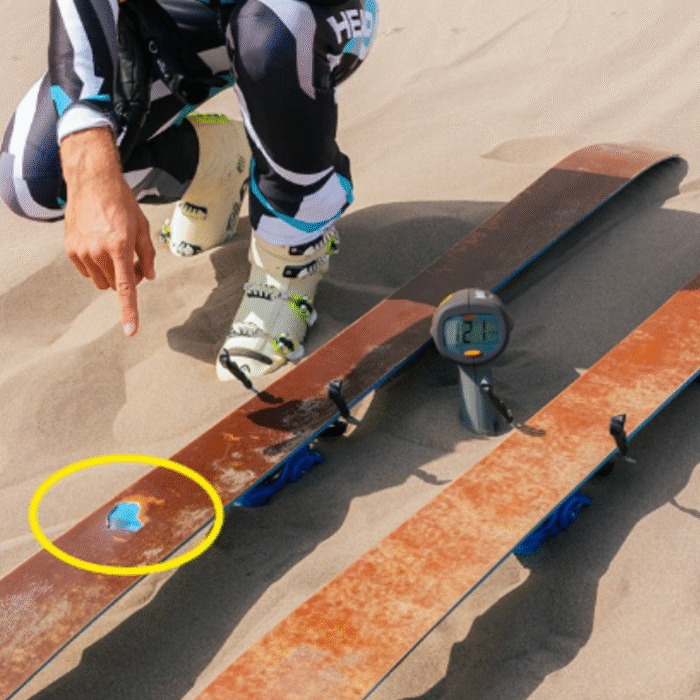 French skier inspecting his skis after breaking the world record