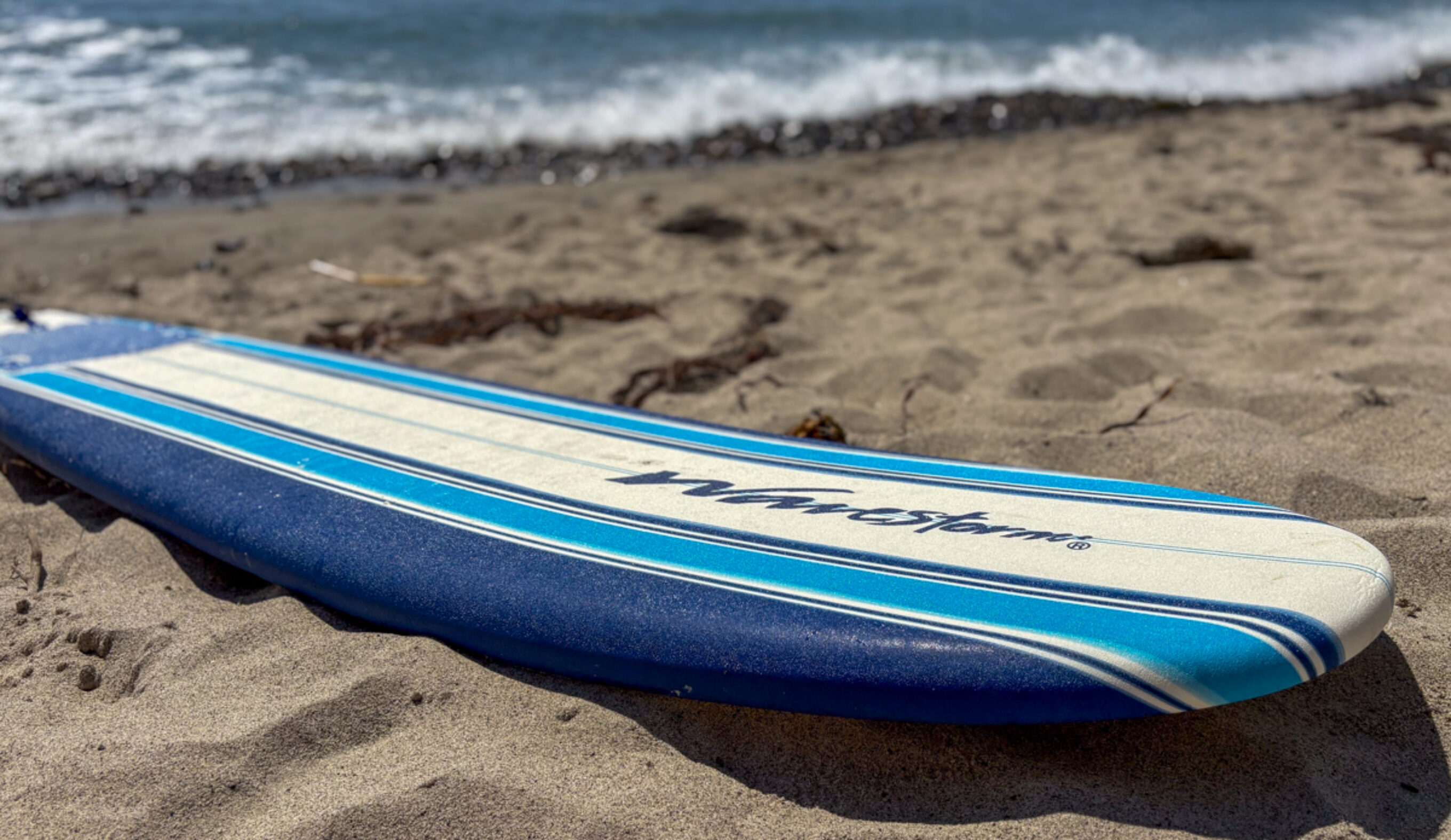wavestorm surfboard on the sand