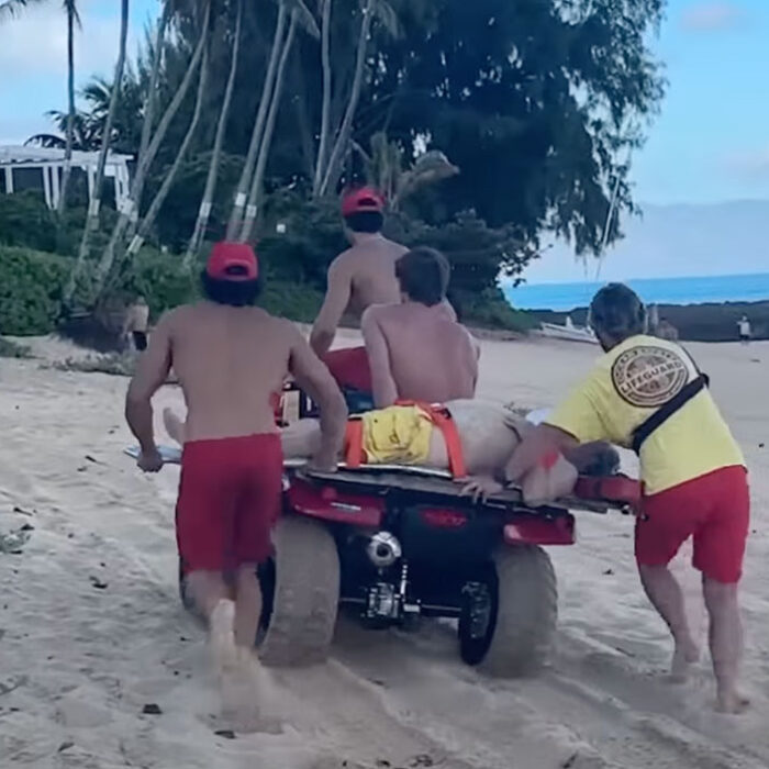 Lifeguards taking drowning victim to hospital from Ke Iki beach